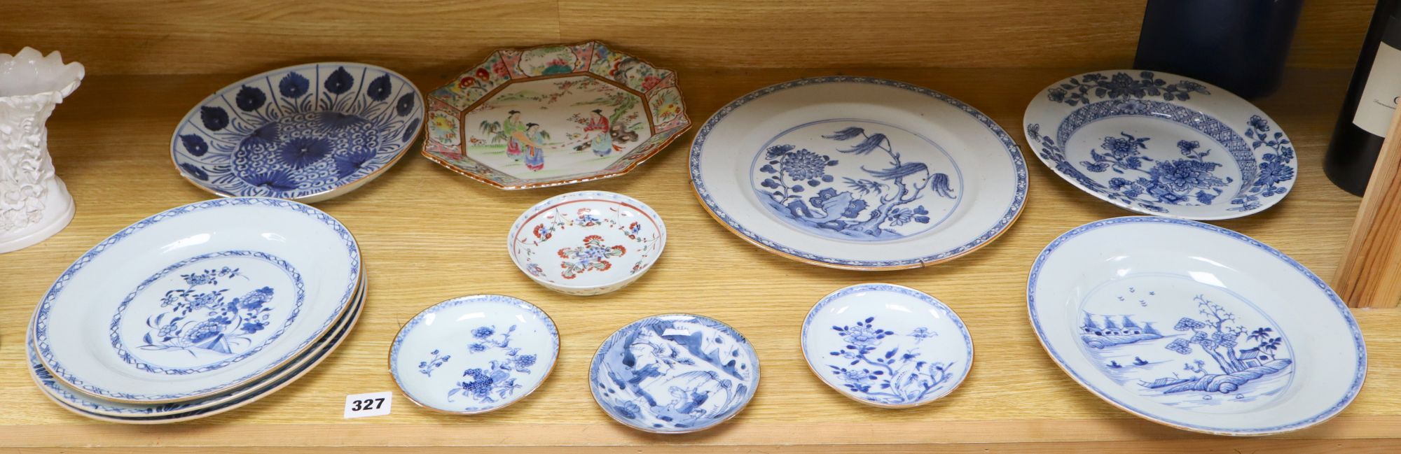 A collection of mostly 18th century Chinese export plates and dishes, a Chinese famille rose dish and another similar smaller dish